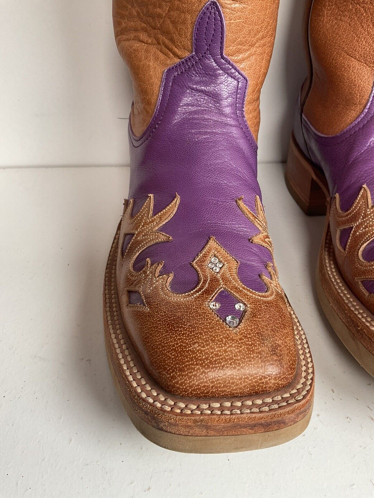 Anderson Bean custom cowgirl boots, size 7 B, in a striking purple color with a crepe sole and detailed tooled wingtip overlay.