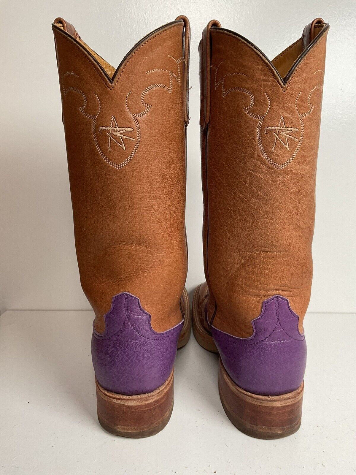 Anderson Bean purple cowgirl boots, custom-made with a crepe sole, size 7 B, and adorned with a tooled wingtip overlay for added detail.