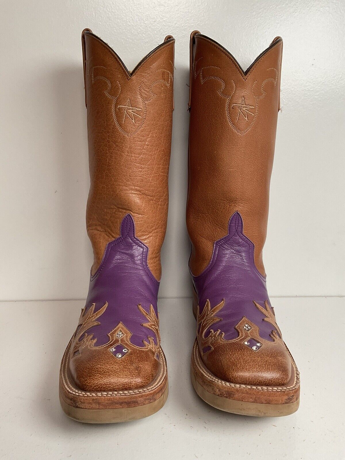 Purple cowgirl boots by Anderson Bean, size 7 B, with a custom design, crepe sole, and intricate tooled wingtip overlay.